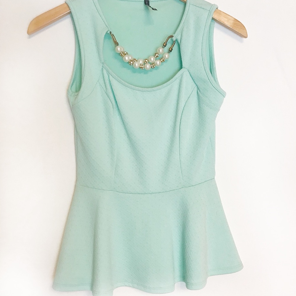 Sleeveless light blue blouse